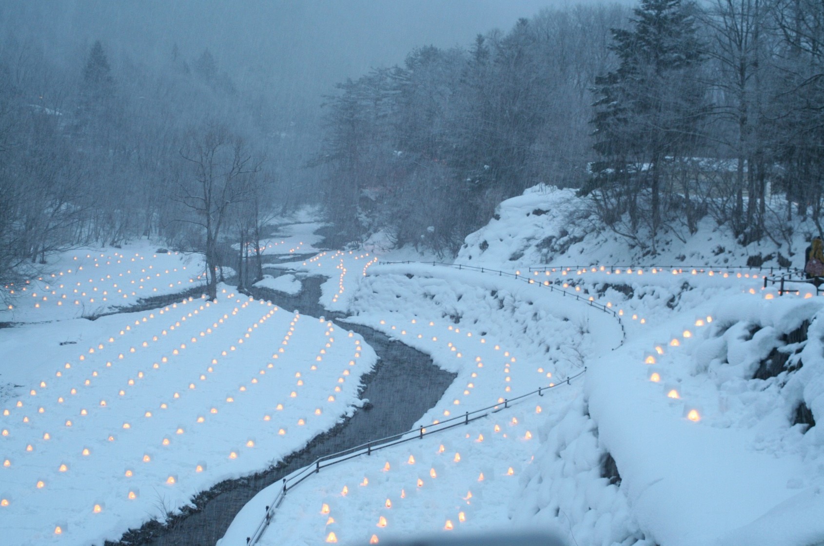 Snow Huts dot Yunishigawa Onsen's Eveningscape